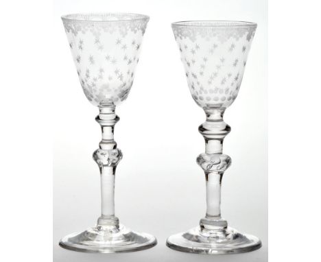 Engraved 'Newcastle' light baluster wine glass, the round funnel bowl with 'C' scroll and pendant decoration enclosing the ri