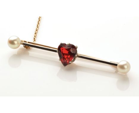 A ruby and cultured pearl bar brooch, the heart-shaped faceted ruby claw set in crown mount, on a yellow metal bar with white