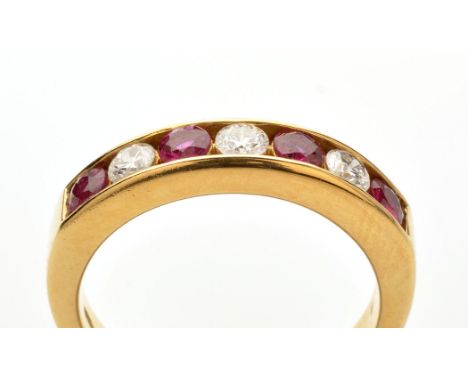 A ruby and diamond ring, the four circular facet cut rubies separated by three brilliant cut diamonds weighing a total of app