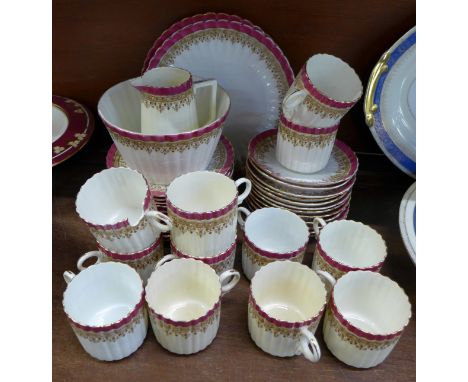 A twelve setting tea service, one cup a/f, some staining, forty pieces in total