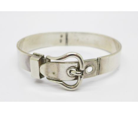 A silver buckle bangle, stamped .800, 52.1g