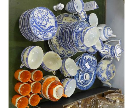 A Japanese blue and white tea set with character marks to the bases, Chinese blue and white china and an orange lustre set of