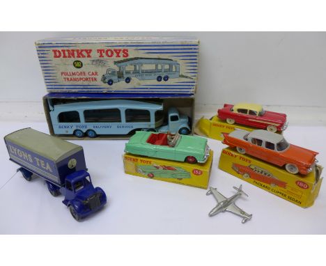 A Dinky Toys Pullmore car transporter 582, boxed, three Dinky Toys cars, Packard Convertible, Packard Clipper Sedan and a Hud