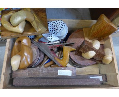 A collection of studio wood carvings and wood turning blanks and tools