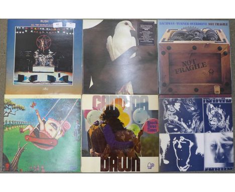 Six LP records, Rush, Little Feat, Candida Dawn, Bachman Turner Overdrive, The Rolling Stones and Santana