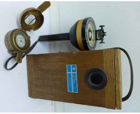 A Saura Marine Instruments Hand Bearing Compass, Tokyo, Japan, cased, and a reproduction compass