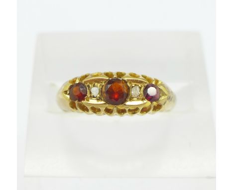 An 18ct gold, garnet and diamond ring, 3.6g, O