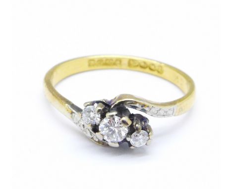 A 22ct gold, three stone diamond crossover ring, Birmingham 1949, 2.9g, M