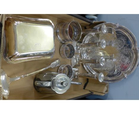 A set of four Parks of London silver plated candlesticks, a plated tray, an Elkington plate entree dish, a plated ladle, wine