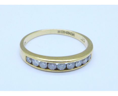 An 18ct gold and diamond half eternity ring, 2g, K