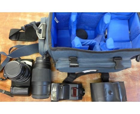 A Canon EOS 1000F camera with a 35-80mm zoom lens, a Canon 100-200 zoom lens, two lens hoods, a Canon 300E2 Speedlite and a c