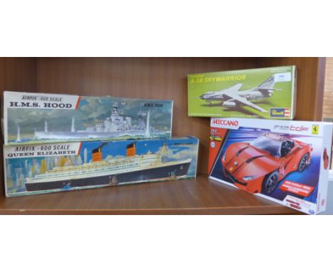 Four model kits; two Airfix 600 scale, HMS Hood and Queen Elizabeth, a Revell Douglas A-3B Sky Warrior and a Meccano F12 Supe