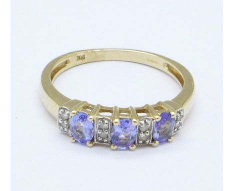 A 9ct gold, diamond and blue stone ring, 2.1g, O