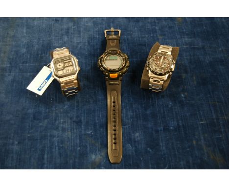 A Casio Edifice stainless steel wrist watch, WR10BAR, cased, together with Casio Illuminator World Time, boxed and a other lo