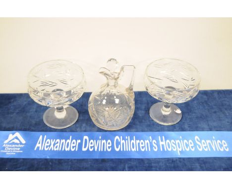 A pair of early 20th century cut glass footed bowls, with nice thistle decoration, 16cm high, together with a cut glass ewer 