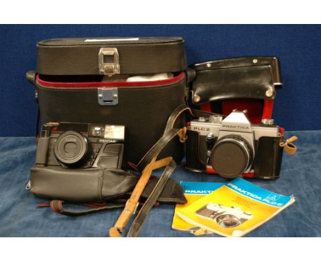 A Pratica 35mm SLR PLC s Camera and Pentacon lens, carry case, and two manuals, and a Pentax cmpact camera, light meter, flas