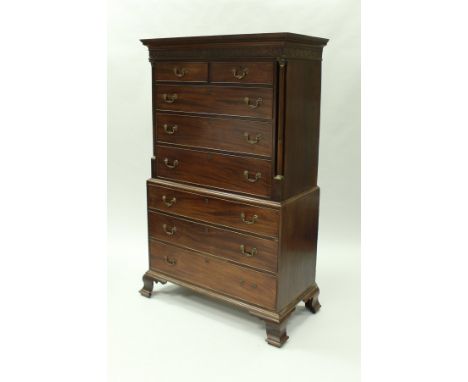A late George III mahogany chest on chest, the upper section with Greek key style decorated cornice over a blind fretwork dec
