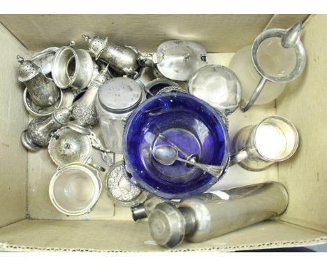 A box containing various small silverwares including two pairs of baluster peppers, various other condiments, flask, silver t