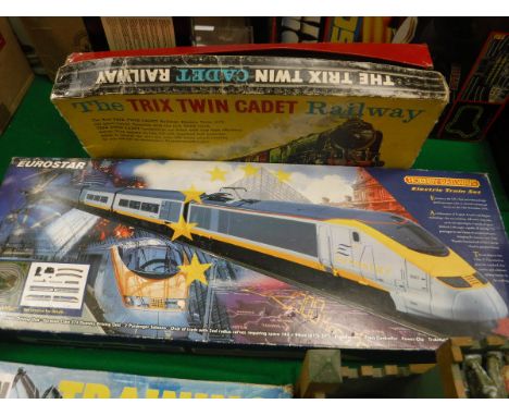 A Hornby Railways Eurostar electric trainset boxed, a Trix twin cadet railway set boxed and a small vintage painted wooden ro