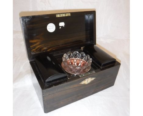 An early 19th Century coromandel and mother of pearl inlaid tea caddy