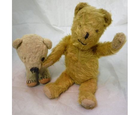 A Chad Valley polar bear cub together with a gold plush bear with jointed arms and legs bearing indistinct label to foot