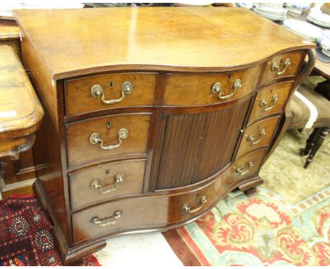A 19th Century mahogany serpentine fronted chest, the plain top with molded edge above a single long drawer has three over a 