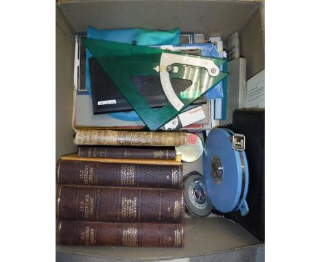 A box containing various engineers/surveyors ephemera including drawing set, tape measures, two volumes I.C.S. Reference Libr