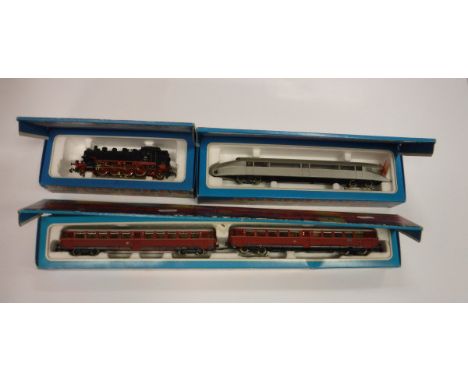 A Märklin Rail car (3076), boxed, a Rail Zeppelin (3077), boxed and a DB engine (3096), boxed