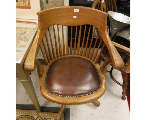 An American oak comb back swivel office chair