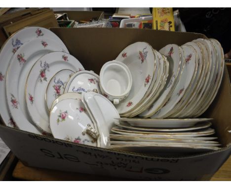 A collection of Spode Copelands china "Rose and Ribbon" decorated dinner wares with gilt rims