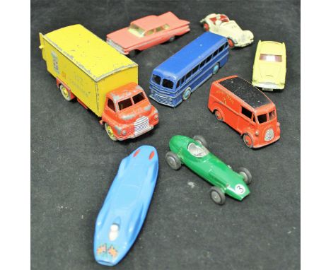 A collection of various die-cast vehicles including Dinky Toys Jaguar (157), Austin Healey (109), Aston Martin (drop head wit