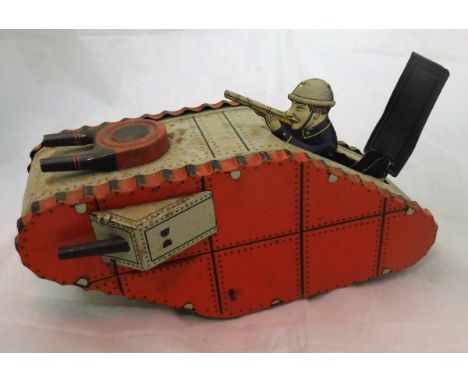 A circa 1930 tinplate model of a world war I tank clockwork with pop up gunner inscribed "made in Germany" the wheels inscrib