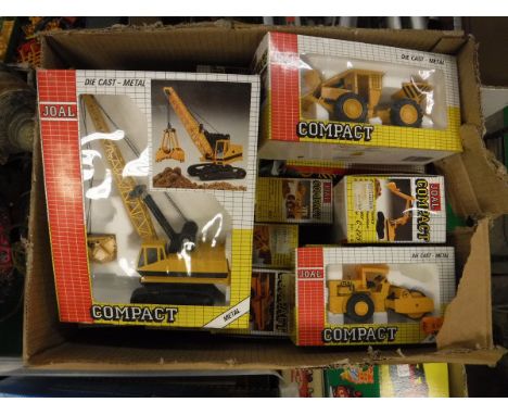A boxed collection of Joal Compact die-cast metal vehicles including Digging crane, Snow plough, Pipe layer, Excavator, Wheel