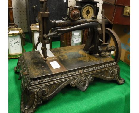 A Victorian Collier sewing machine on ornate bracket foot base