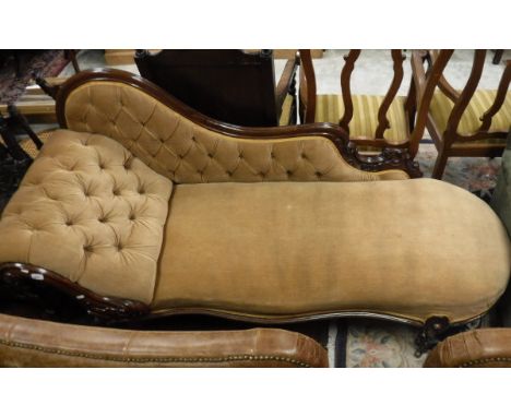 A Victorian mahogany show framed chaise longue with button back upholstery
