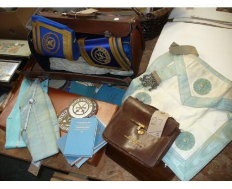 A Collection of Masonic items, leather case, sash and apron, booklets, sew on badges, etc.