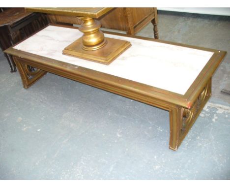 A Continental gilt wood and marble top centre table raised on two open scroll bracket supports.