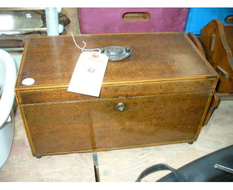 An Early 19th Century mahogany and satinwood inlaid tea caddy with a twin compartmentalised interior.