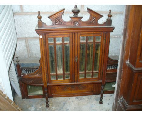 A Victorian walnut over mantle cabinet with two mirrored doors and a marble shelf.