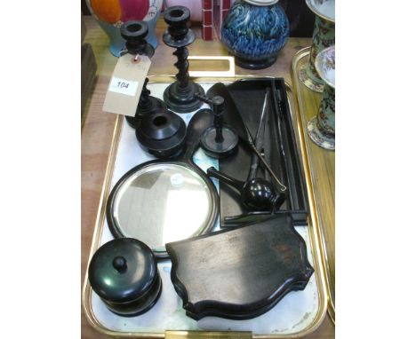 An Ebony dressing table set comprising a pair of barleytwist candlesticks, jar and cover, hand mirror, tray, button hook, etc