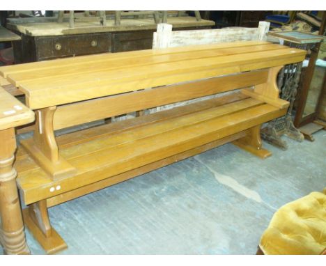 A Pair of ash benches each with a triple slatted tops and plain cross stretchers raised on bracket supports.