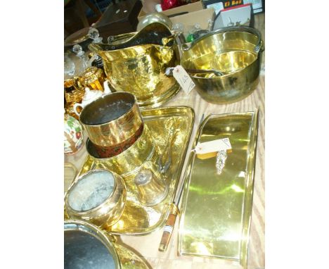 A Collection of brass ware, planters, concave fire front, rectangular tray, coal helmet, brass skellet with iron handle, sauc