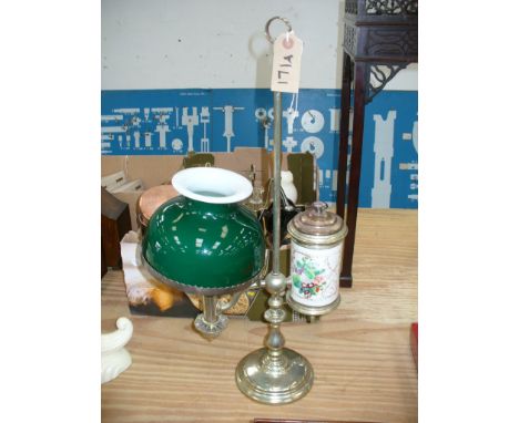 A Victorian plated students lamp with a cylindrical ceramic reservoir .