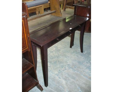 A Modern hardwood console table with three frieze drawers.