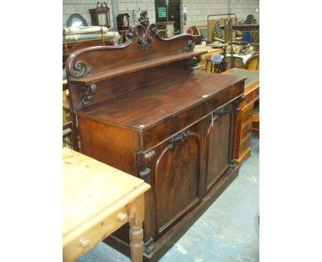 A 19th Century mahogany chiffonier sideboard , the shaped arched back centred with a flower head crest above a shelf , rectan