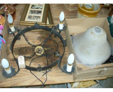 An Iron circular ceiling light fitting with fleu di lis embellishments ,a pair of marbled glass bell shaped light shades, a g