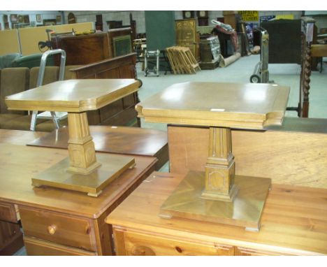 A Pair of hardwood pedestal lamp tables.