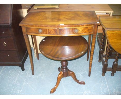 A Reproduction mahogany bow front two drawer side table and a Georgian style mahogany tripod table. (2)