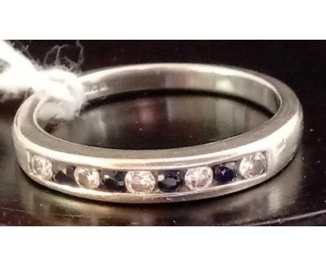 A 9 STONE DIAMOND &amp; SAPPHIRE RING SET IN 9ct WHITE GOLD - SIZE 'P' 