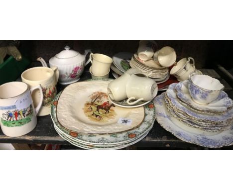 SHELF OF CHINAWARE INCL; JUGS, PLATES, CUP &amp; SAUCERS, SOME HUNTING SCENES ETC